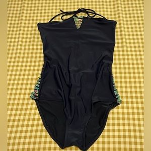 Strapless, backless swimsuit with cutouts